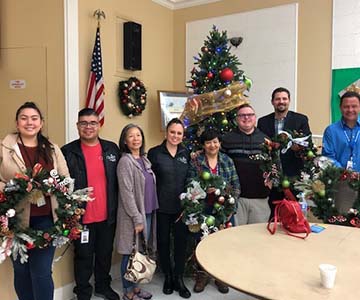 High School seniors pitched in to make Christmas wreaths for senior center